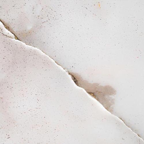 closeup of a cracked and leaking foundation