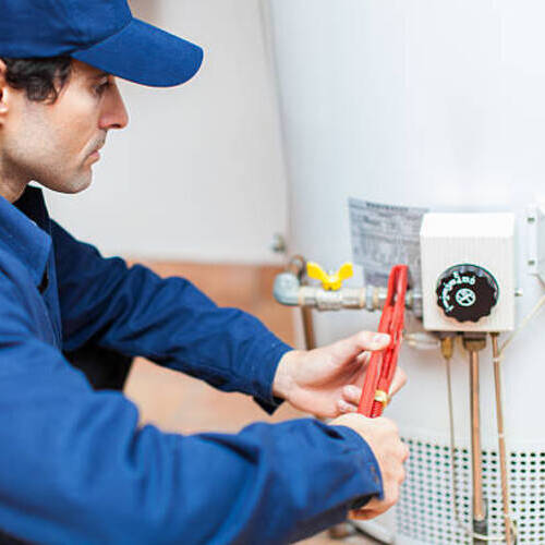 plumber repairing a water heater